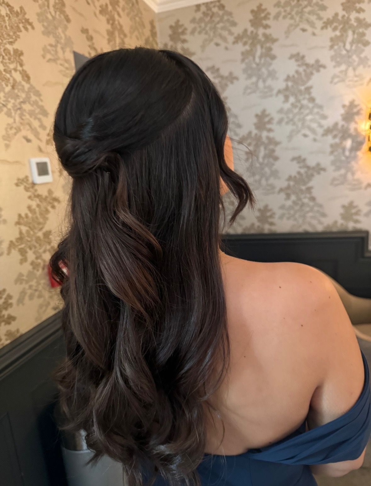 Long dark half-up style with soft waves, seen from behind